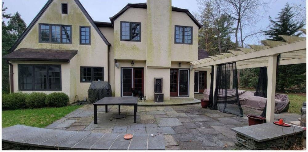Stucco home & patio soft wash before pressure washing
