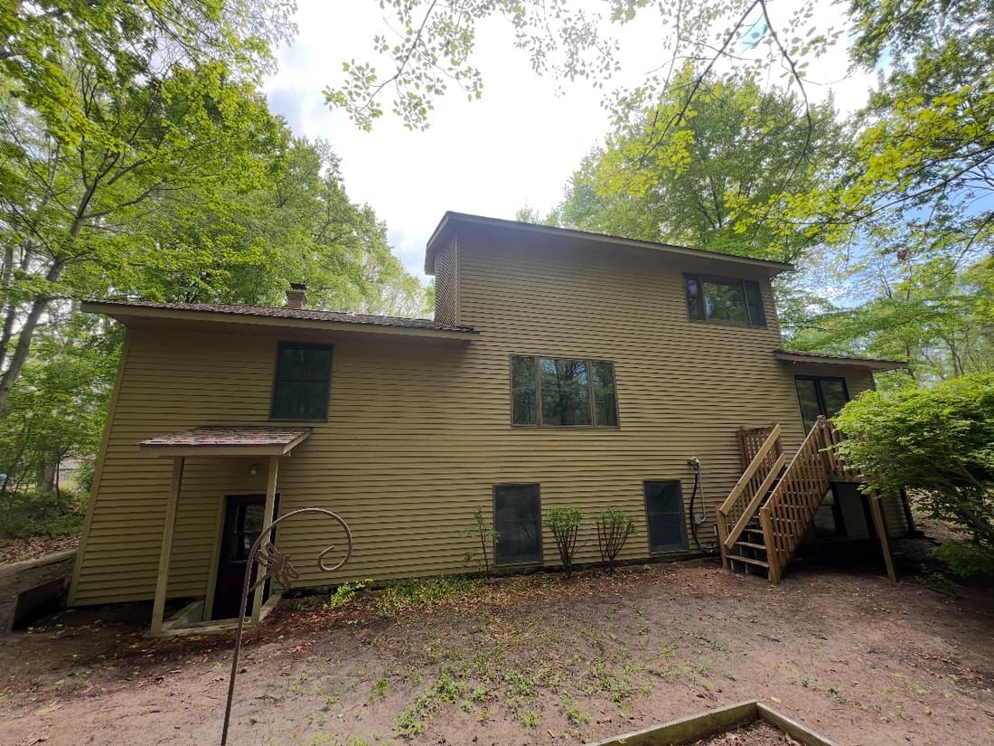 Home exterior soft wash before pressure washing