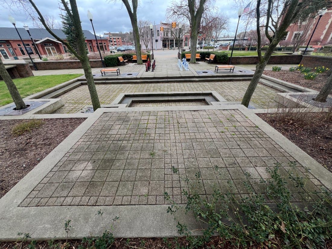 Brick plaza cleaning before pressure washing